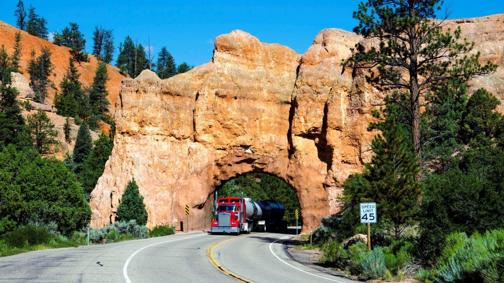 Truck passing through rock tunnel